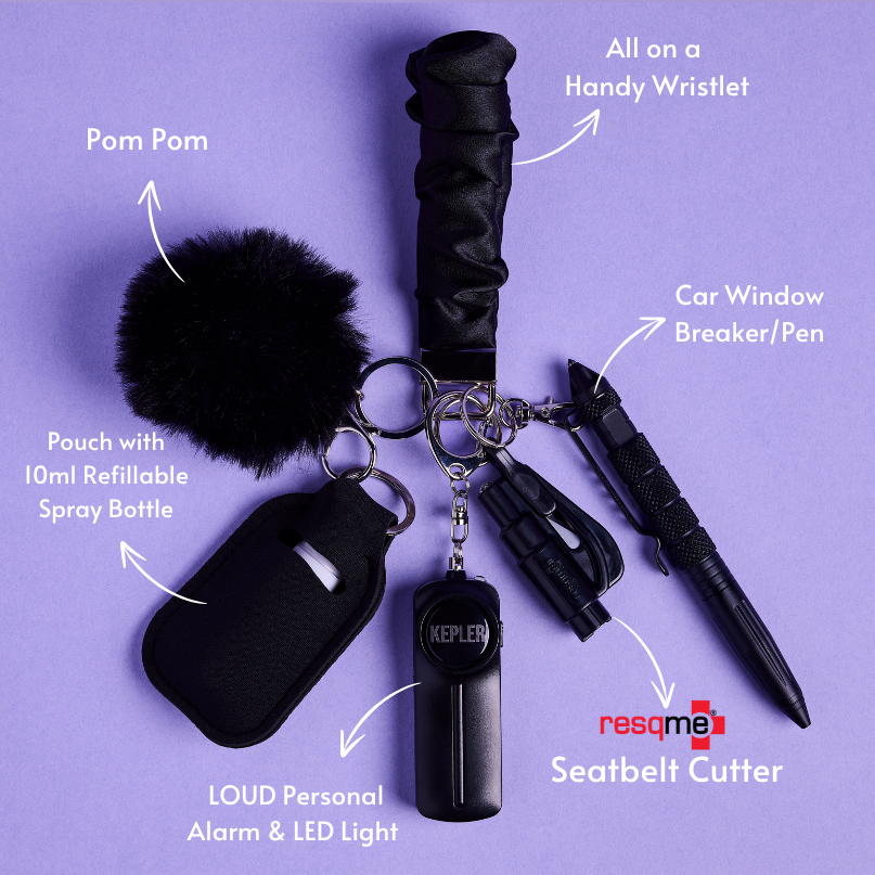Black safety keychain set with various safety tools on a purple background